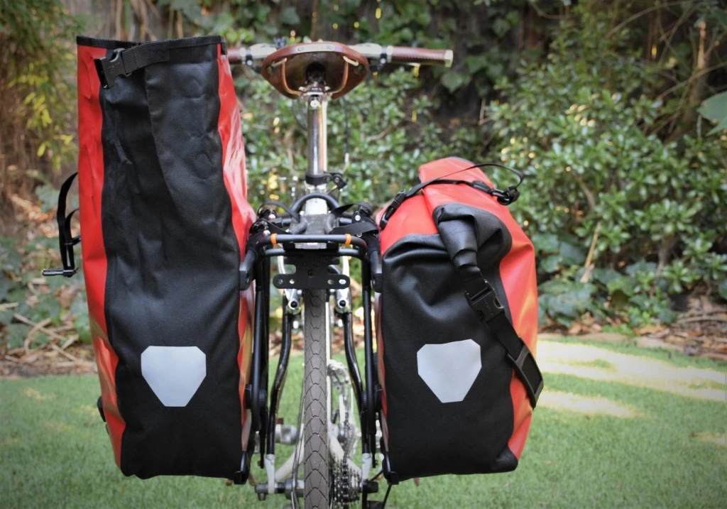 bike panniers - a fully opened back roller pannier (left) demonstrates the huge...