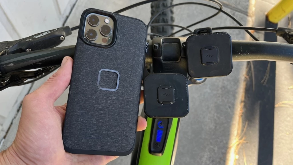 bike phone mount - the sleek peak design case (left), the out front mount (center), and...