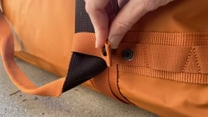 Easily snap the suitcase style handles out of the way when you don't...