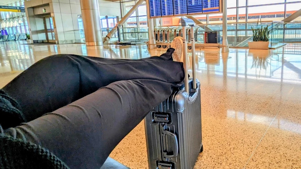 carry on luggage - chillin' with a very expensive footstool.