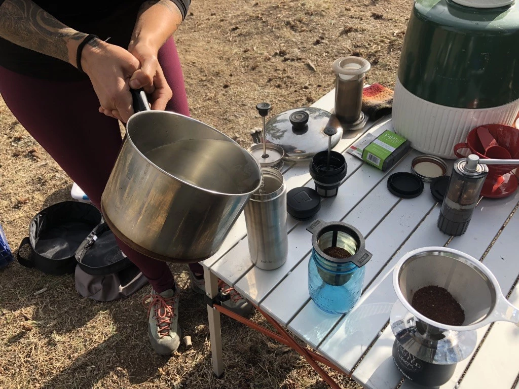 camping coffee - a whole arsenal of coffee makers lined up and ready to be put to the...