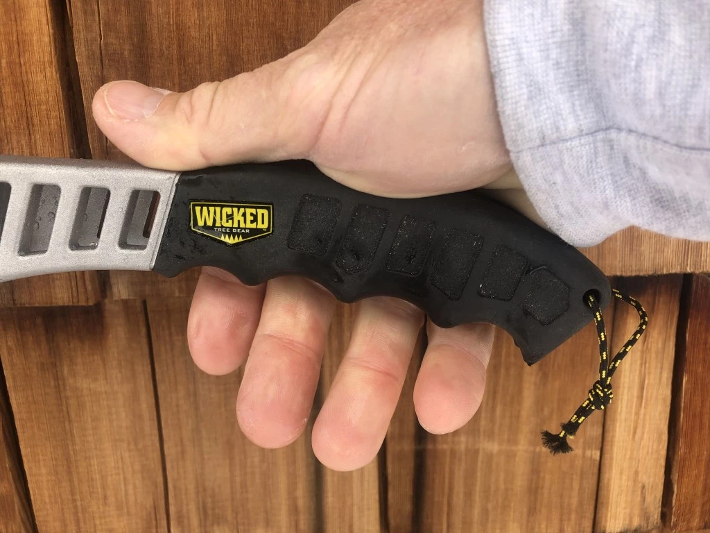 folding saw - the wicked tough hand saw's grip has indentations for your fingers.