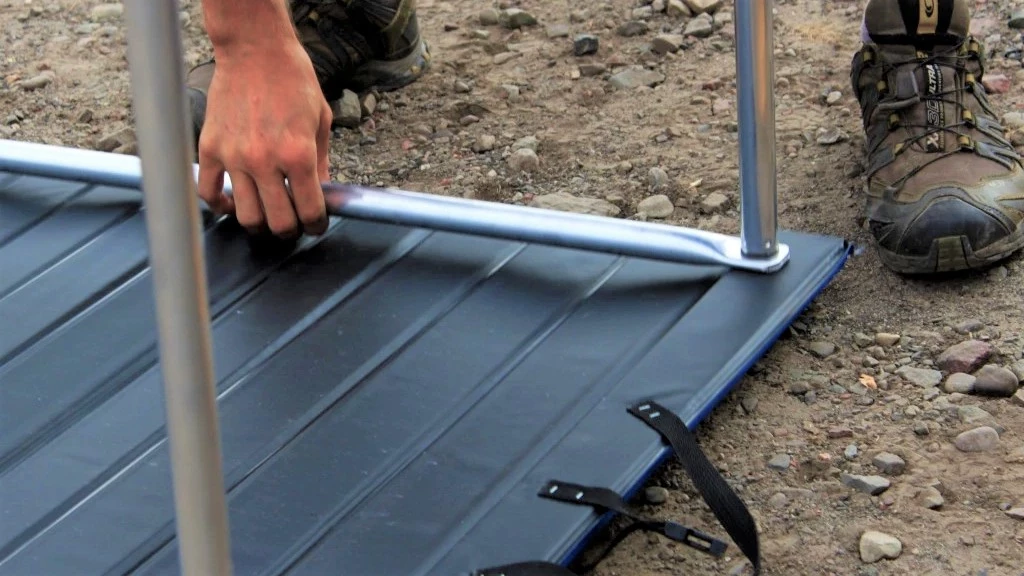 camping table - put the crossbeams in place and then thread in each of table's...